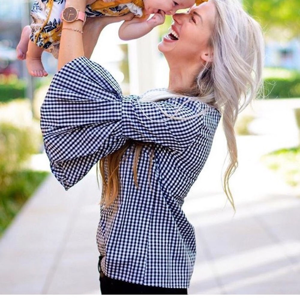 Black gingham bell sleeve top.